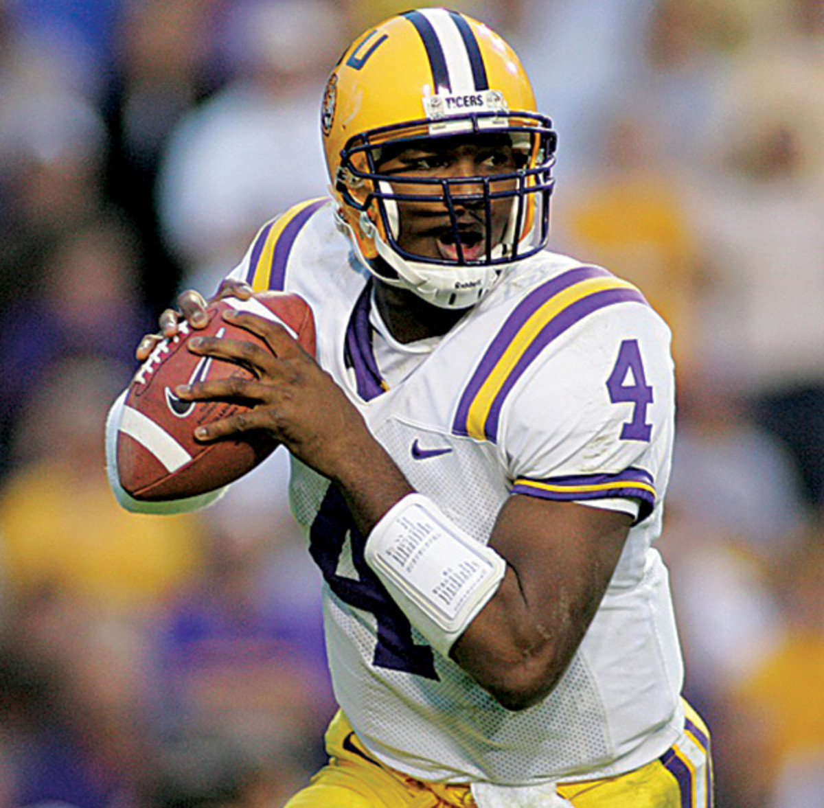 Louisiana State Tigers JaMarcus Russell (4) rolls out looking to throw against the Arkansas Razorbacks in the 4th quarter of action Friday Nov. 25, 2005 at Tiger Stadium. LSU defeated Arkansas 19-17 clinching the SEC Western Division.